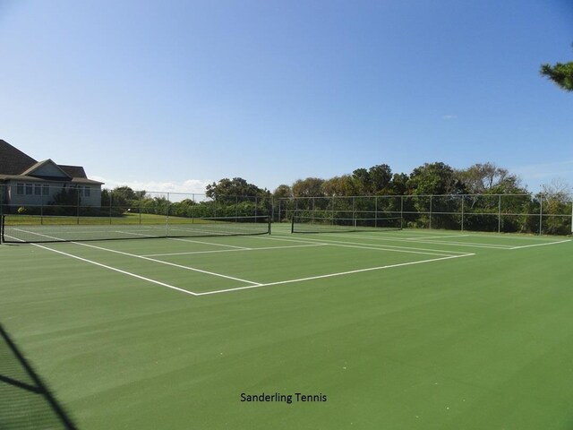 view of sport court with fence