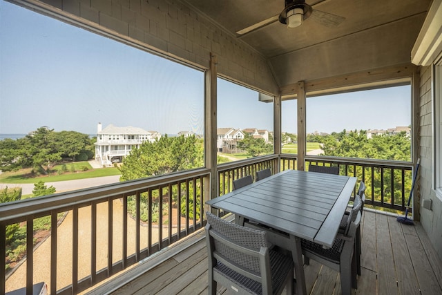 wooden deck featuring outdoor dining space and a ceiling fan