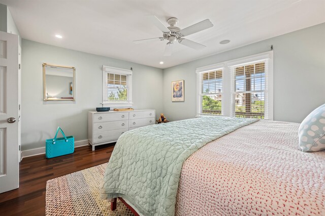 bedroom with multiple windows, baseboards, dark wood finished floors, and recessed lighting