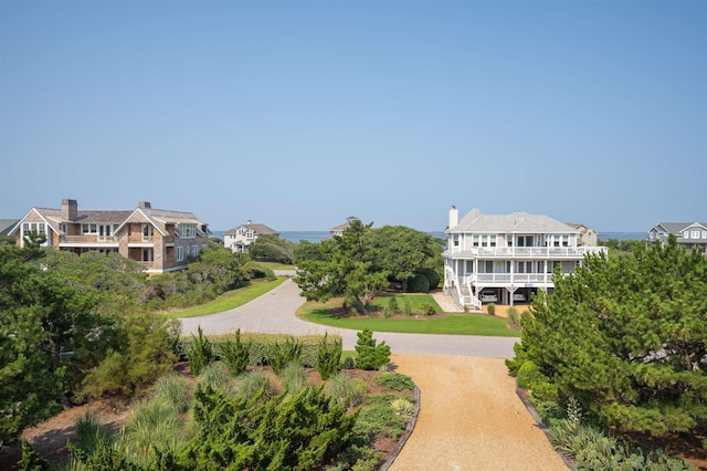 view of home's community featuring driveway