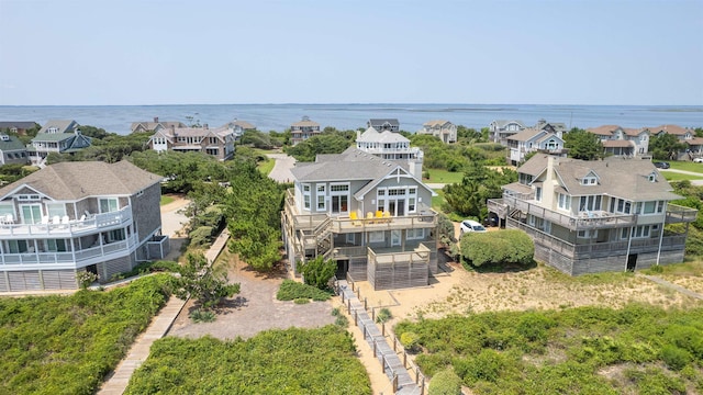 birds eye view of property featuring a water view and a residential view