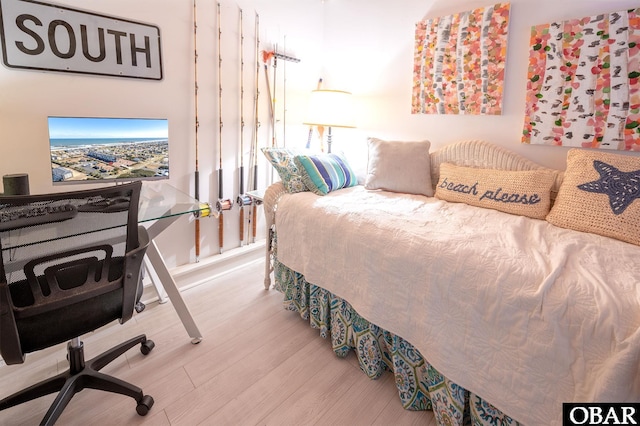 bedroom featuring wood finished floors