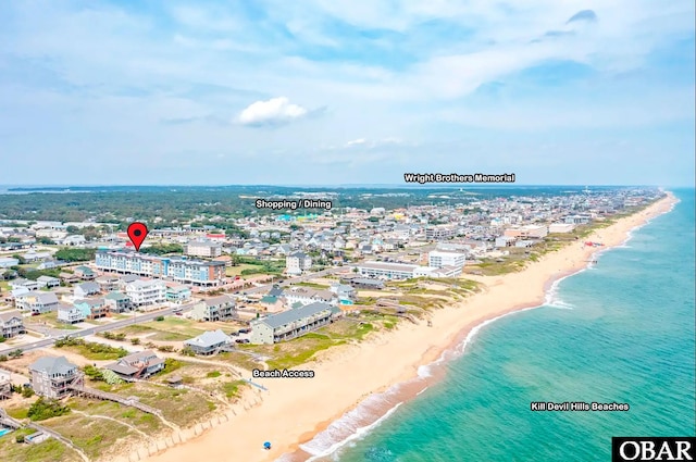 bird's eye view featuring a water view, a city view, and a view of the beach