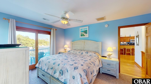 bedroom with visible vents, ceiling fan, and access to outside