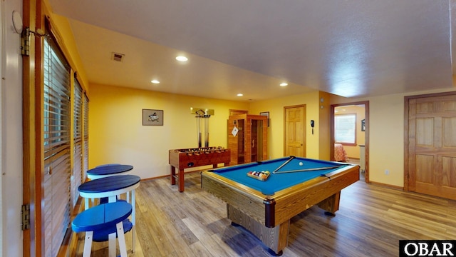 recreation room featuring recessed lighting, visible vents, baseboards, and light wood finished floors