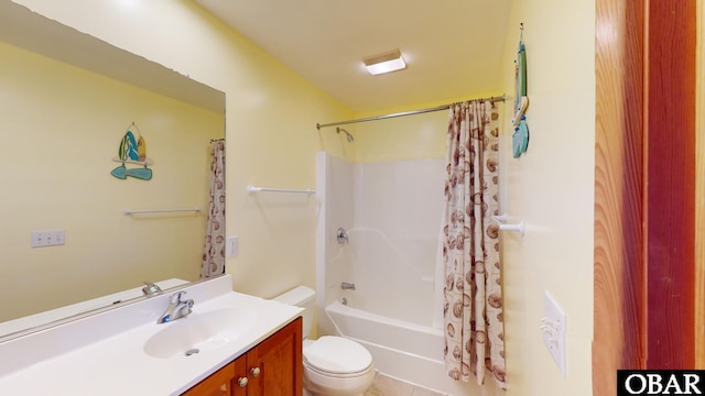 bathroom featuring toilet, shower / bath combo, and vanity