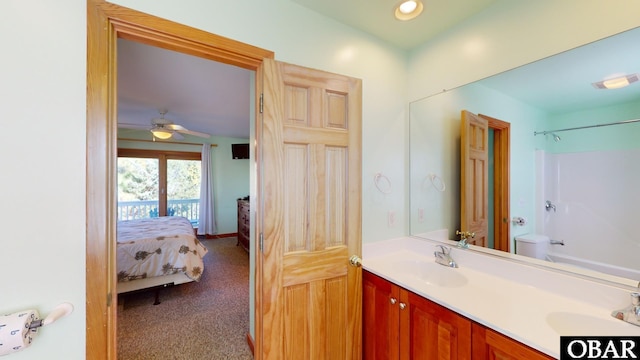 full bathroom featuring double vanity, connected bathroom, bathing tub / shower combination, and a sink