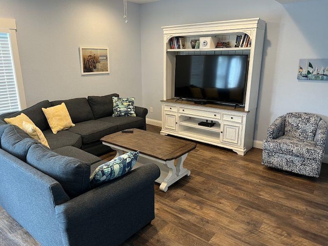 living room with dark wood-style floors and baseboards