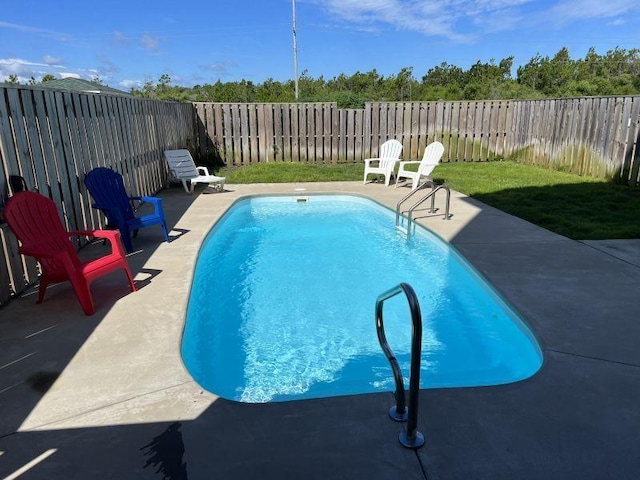 view of pool featuring a patio, a fenced backyard, and a fenced in pool