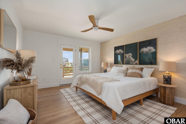 2072 Sandfiddler Rd Lot 85, Corolla, NC 27927 - bedroom with access to outside, baseboards, light wood-style floors, and a ceiling fan