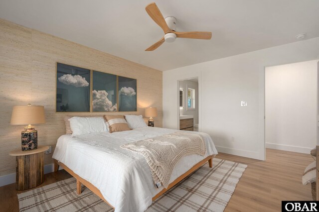 2072 Sandfiddler Rd Lot 85, Corolla, NC 27927 - bedroom featuring baseboards, wood finished floors, a ceiling fan, and ensuite bathroom