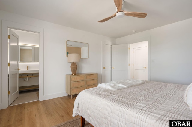 2072 Sandfiddler Rd Lot 85, Corolla, NC 27927 - bedroom with light wood-style floors, baseboards, a closet, and a ceiling fan