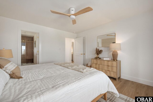 2072 Sandfiddler Rd Lot 85, Corolla, NC 27927 - bedroom featuring light wood-style flooring, baseboards, a ceiling fan, and ensuite bath