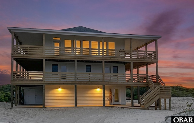 2072 Sandfiddler Rd Lot 85, Corolla, NC 27927 - back of house at dusk with a wooden deck and stairway