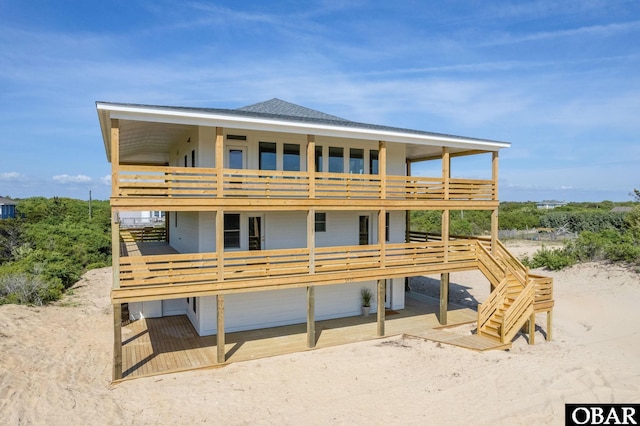 2072 Sandfiddler Rd Lot 85, Corolla, NC 27927 - rear view of property featuring a balcony and roof with shingles