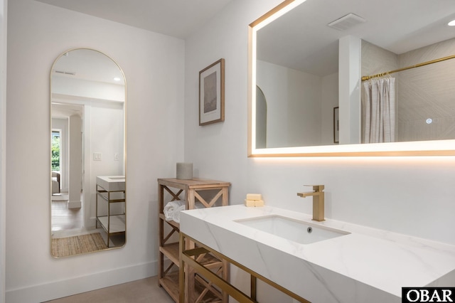 2072 Sandfiddler Rd Lot 85, Corolla, NC 27927 - bathroom featuring vanity, baseboards, and a shower with curtain