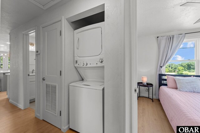 40048 Marlin Dr Lot 152, Avon, NC 27915 - washroom with estacked washer and dryer and light wood-style floors