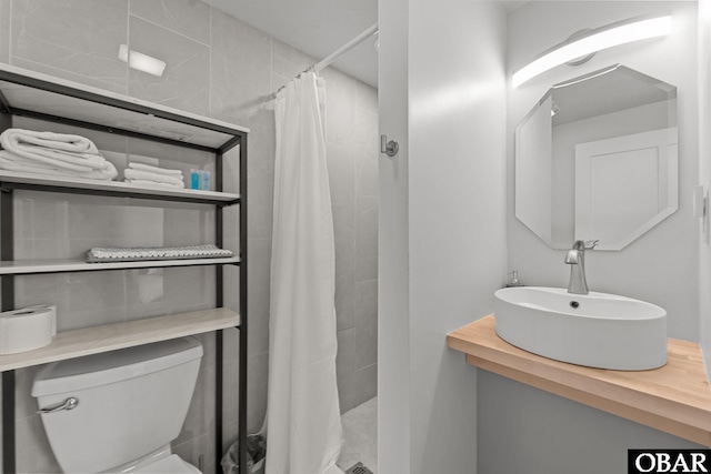 40048 Marlin Dr Lot 152, Avon, NC 27915 - bathroom featuring toilet, a sink, and tiled shower