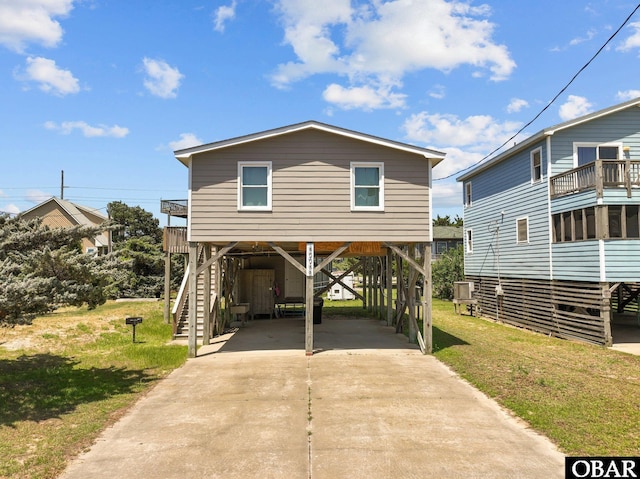 40048 Marlin Dr Lot 152, Avon, NC 27915 - beach home with a carport, driveway, stairway, and a front yard