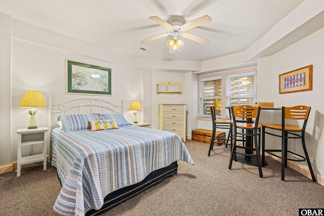 carpeted bedroom featuring baseboards