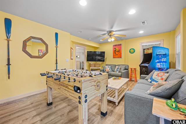 game room with light wood-type flooring, ceiling fan, baseboards, and recessed lighting