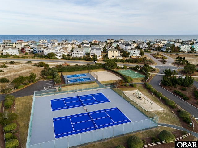 drone / aerial view with a water view and a residential view