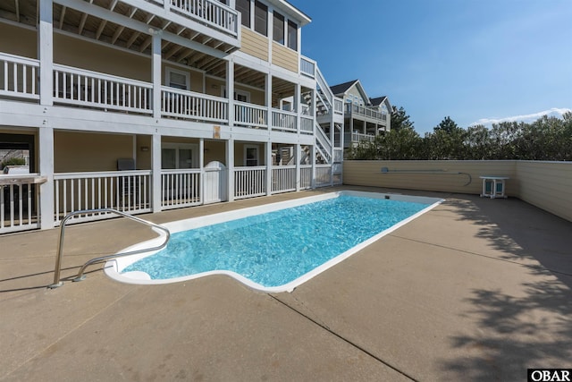 view of swimming pool with a patio area and a fenced in pool