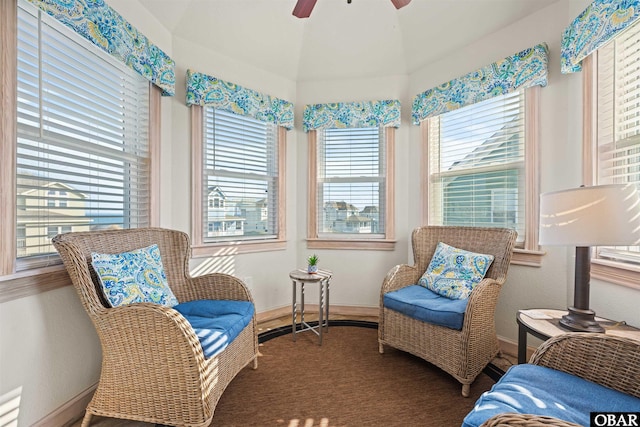 sitting room featuring baseboards and a ceiling fan