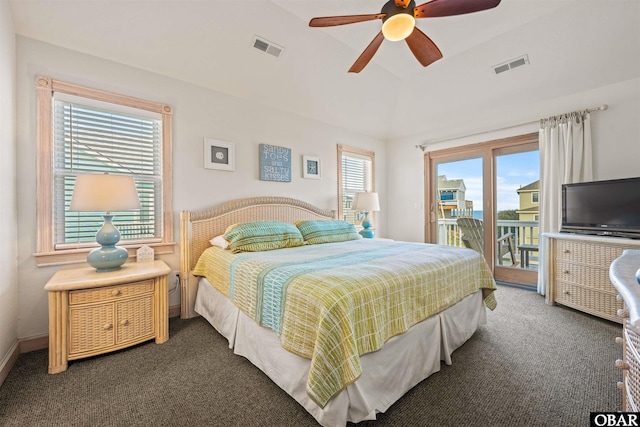 bedroom featuring vaulted ceiling, access to outside, dark carpet, and visible vents