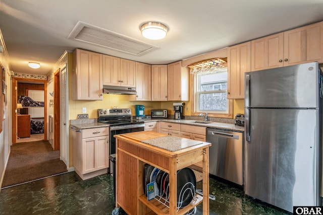 23193 W Corbina Dr Lot 24, Rodanthe, NC 27968 - kitchen with under cabinet range hood, light brown cabinetry, stainless steel appliances, and a sink