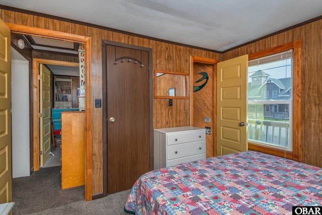 23193 W Corbina Dr Lot 24, Rodanthe, NC 27968 - bedroom featuring crown molding, multiple windows, wooden walls, and carpet