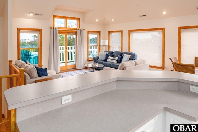 living room featuring visible vents and recessed lighting