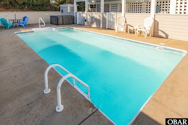 view of pool with a fenced in pool