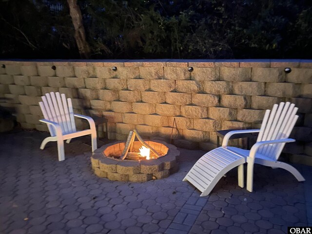 view of patio / terrace featuring a fire pit