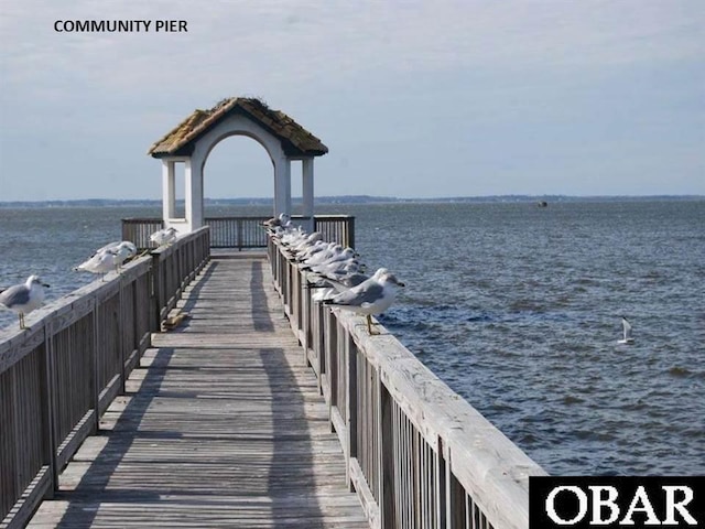 dock area featuring a water view