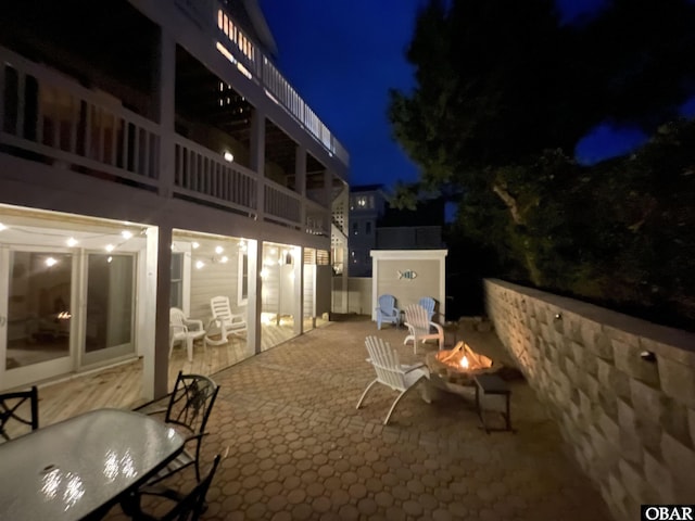 patio at night with a fire pit