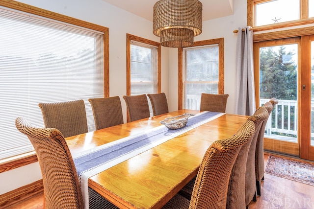 dining room with an inviting chandelier and light wood-style flooring