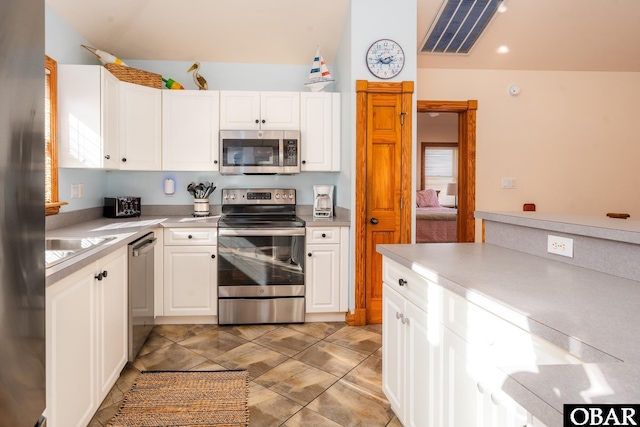 kitchen with white cabinets, visible vents, appliances with stainless steel finishes, and light countertops