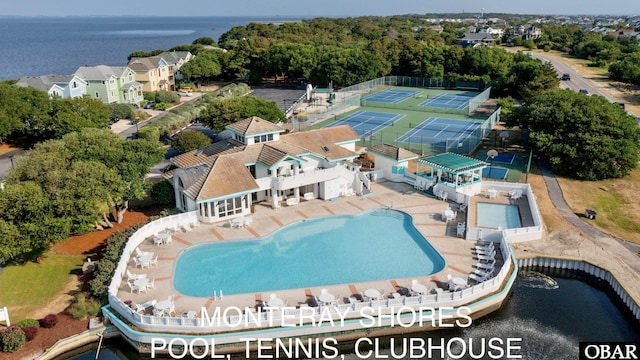 birds eye view of property with a water view