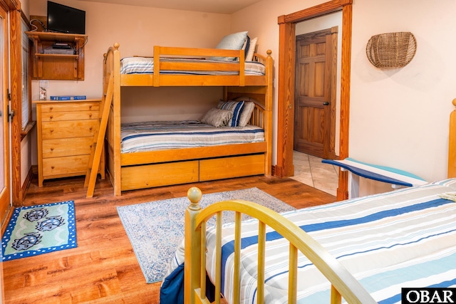 bedroom with wood finished floors