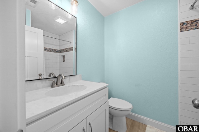 1021 Harbour View Dr Lot 43, Kill Devil Hills, NC 27948 - full bath featuring tiled shower, vanity, wood finished floors, and a textured wall