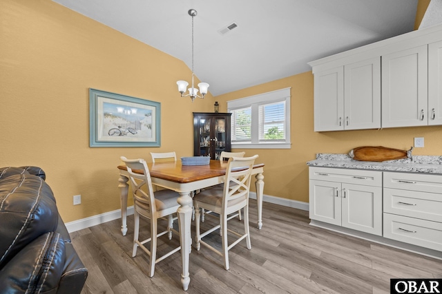 1021 Harbour View Dr Lot 43, Kill Devil Hills, NC 27948 - dining area with vaulted ceiling, a chandelier, and light wood-style flooring