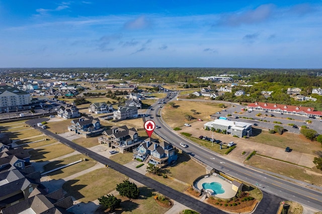 birds eye view of property with a residential view