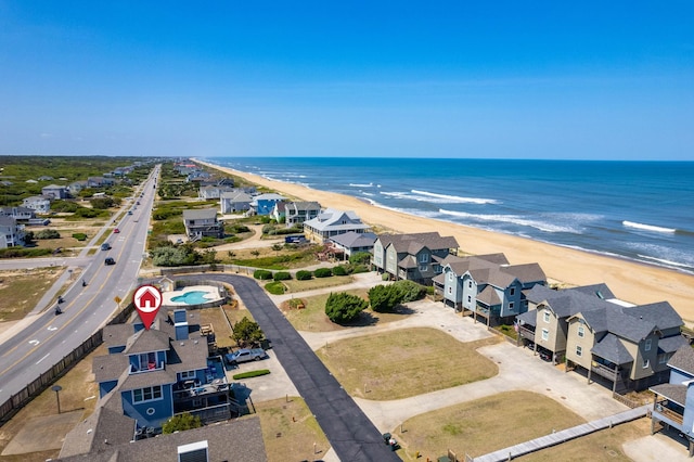 bird's eye view featuring a residential view, a water view, and a beach view