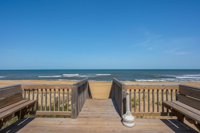 view of property's community featuring a view of the beach and a water view