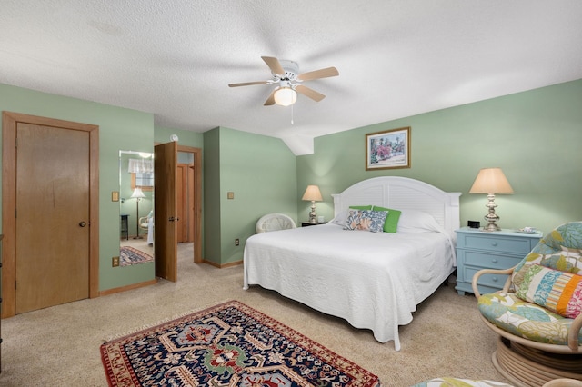 bedroom featuring ceiling fan, baseboards, and a textured ceiling