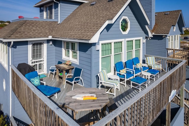 deck with outdoor dining area