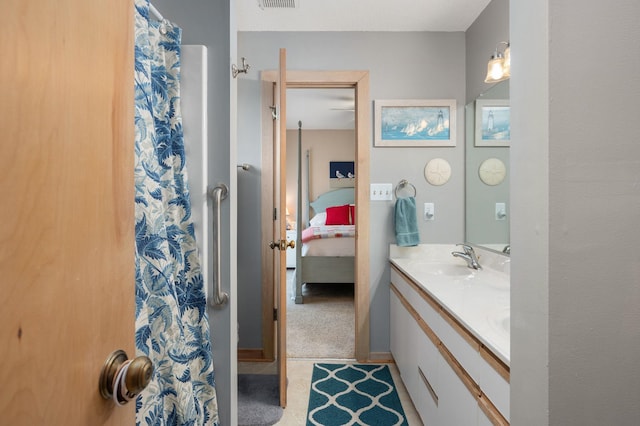 full bathroom with visible vents, vanity, and ensuite bath