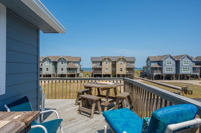 wooden terrace with a residential view