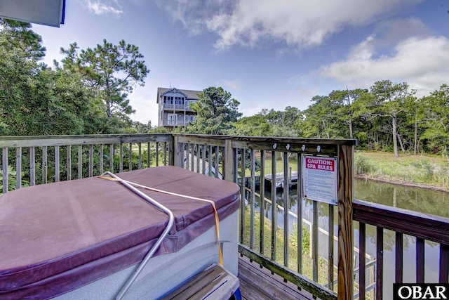 50050 Bayside Ct Lot 30, Frisco, NC 27936 - wooden deck with a hot tub and view of wooded area